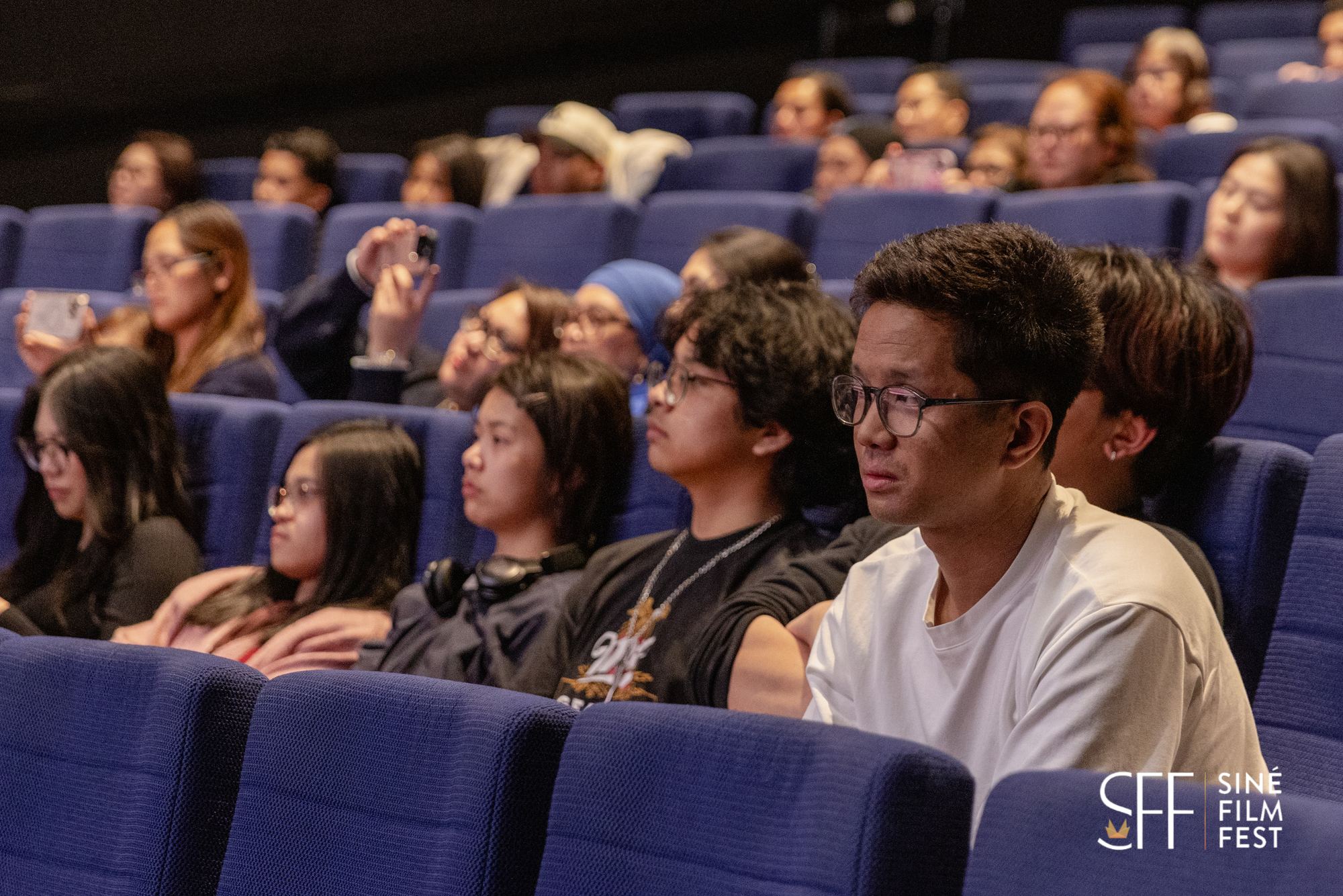 Young audience members watching a film at Siné Film Fest