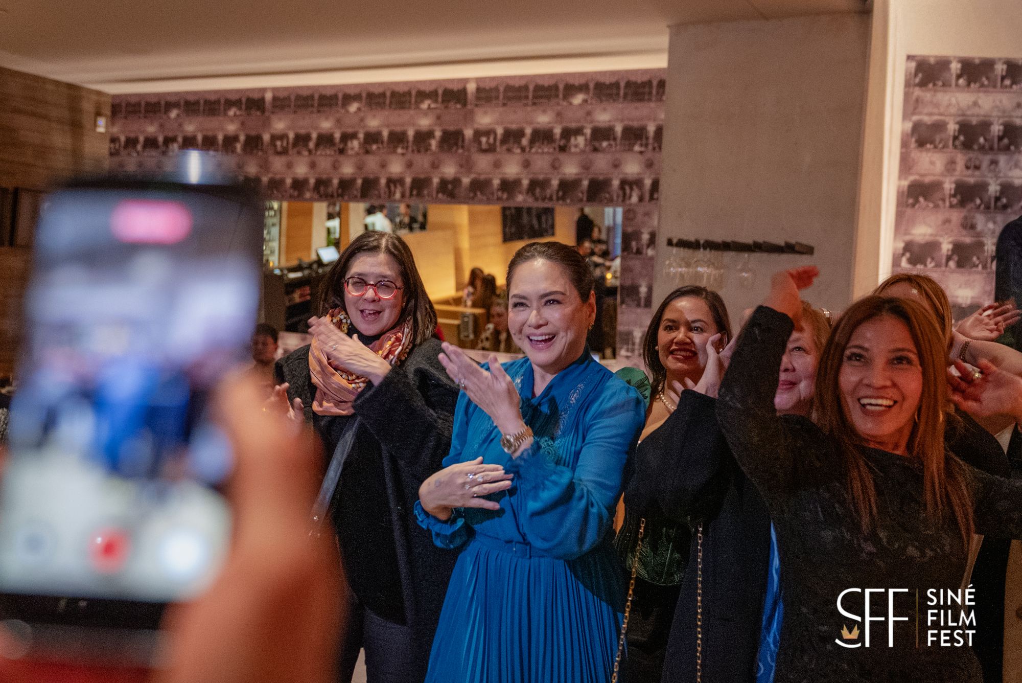 Guests celebrating at a Siné Film Fest party