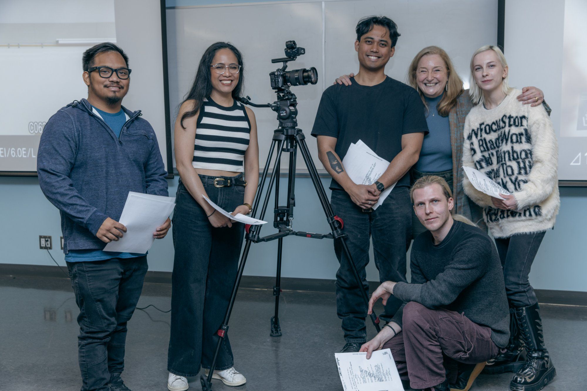Participants with a cinema camera at a Siné filmmaking workshop