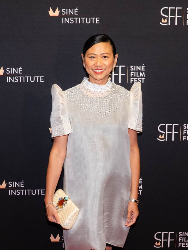 Guest in a white dress on the Siné Film Fest red carpet