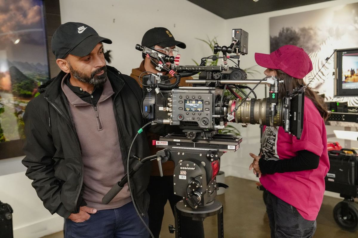 Young crew members working with a cinema camera